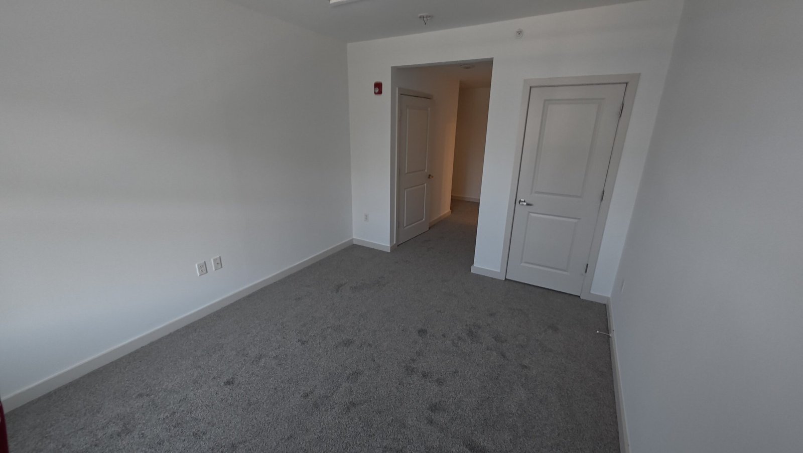 Interior room with white walls, closet door and trim from the project gallery