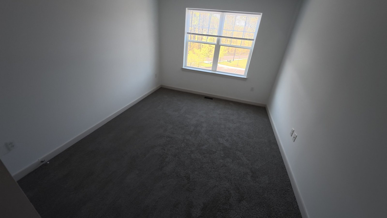Bedroom with gray carpet and white walls from the project gallery